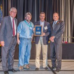 Representatives from Hemphill County Airport in Canadian, TX, receive an aviation award.