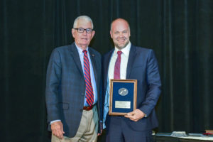 Aaron Barth accepts best Reliever Airport Manager of the Year award at the 2019 Texas Aviation Conference.