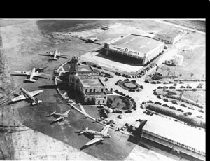 Ariel shot of building with multiple airplanes on the side
