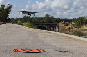 A drone landing on a landing zone on the concrete